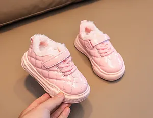 Pink glossy patent leather kids winter boot with quilted pattern and warm fleece lining