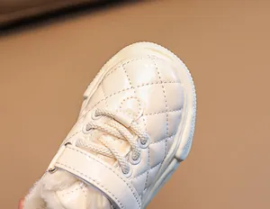 Detailed view of quilted faux leather winter baby shoes with warm faux fur lining