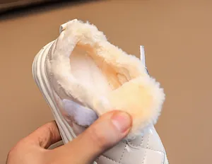 Detail shot of warm fleece lining and quilted faux leather on toddler winter boots