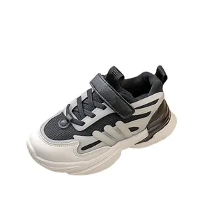 Kids luminous chunky sneakers in black and white with breathable mesh and velcro straps