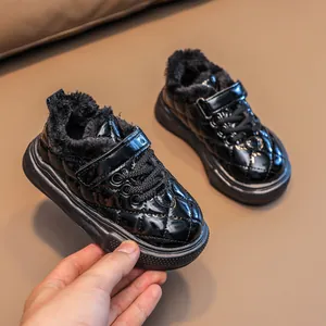 Winter thermal children's sneakers with black glossy diamond quilting and warm faux fur lining