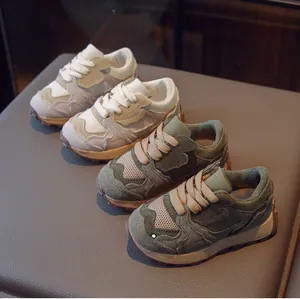 Detail of kids vintage running shoes showing suede textures and high-quality fabric mesh