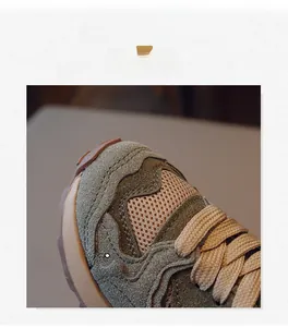 Detailed macro view of kids retro sneakers featuring premium suede and breathable mesh