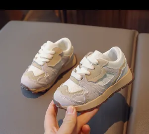 Close-up of lightweight children's sneakers with beige suede and mesh texture