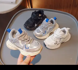 Close-up of kids breathable mesh sneakers in black, silver, and white colorways