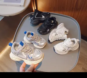 Detailed top view of kids breathable mesh sneakers in black white and silver grey colors