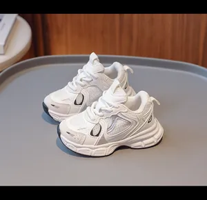 Macro detail of breathable beige kids sneakers with thick cushioning sole and mesh design