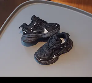 Top view of kids black mesh sneakers showing breathable texture and durable sole