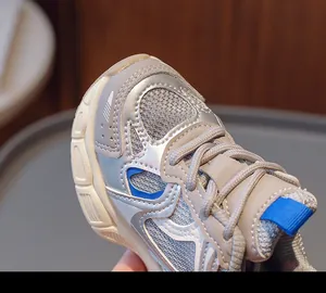 Detailed macro view of children's breathable mesh sneakers with blue accents