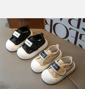 Detail of quilted kids sneakers with velcro straps and non-slip rubber outsoles