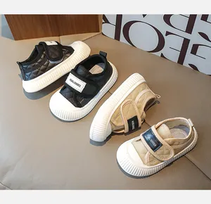 Detail of baby toddler shoes with quilted stitching and anti-slip white rubber soles