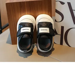 Detail of baby walking shoes with quilted design and anti-slip thick white rubber sole