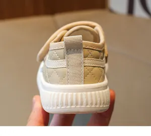 Detailed back view of beige toddler sneakers with quilted texture and non-slip thick sole