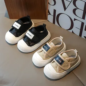 Quilted toddler sneakers in black and beige with non-slip soles and velcro straps