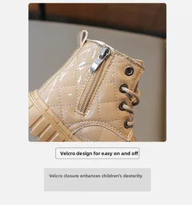 Detail of children's khaki patent leather boots with quilted stitching and side zipper