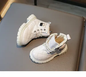 Detail of white quilted children's boots with patent finish and warm fleece lining