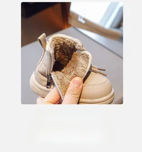Close-up of cozy warm brown fleece lining and metallic side zipper of kids winter boot