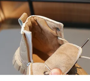 Close-up of the thick warm plush lining inside kids winter boots for cold weather