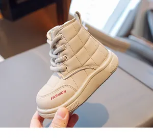 Detail view of beige quilted kids snow boots featuring side zipper and warm faux fur lining