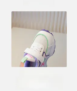 Detail of breathable mesh upper and round toe of children's white sporty sneakers