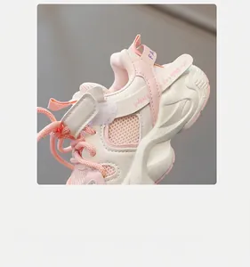 Detail of pink kids sneakers showing the velcro strap design for easy on and off wear