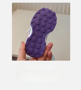 Close-up of non-slip rubber sole with size 23 mark on breathable kids sneakers