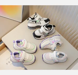 Close-up of colorful breathable mesh toddler shoes with star patterns and velcro straps