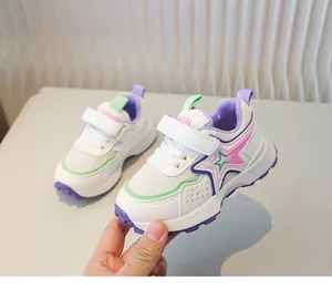 Detail of kids breathable mesh sneaker with velcro strap and gradient star patch