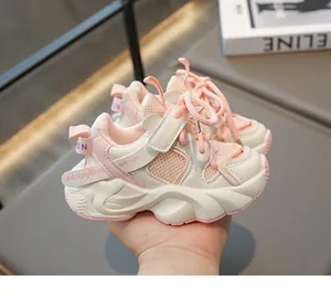 Detail of pink and beige kids chunky sneaker with breathable mesh and velcro closure