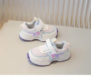 Detail of kids breathable mesh sneaker with pink star and velcro strap closure