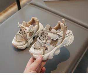 Close-up of kids' chunky sneakers featuring breathable mesh and velcro straps