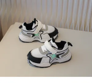 Detailed view of kids mesh sneakers featuring a green star patch and velcro closure