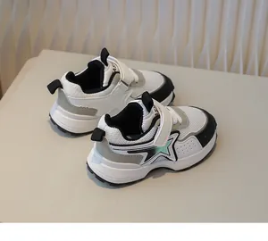 Detail of kids breathable mesh sneaker featuring star pattern and velcro strap design