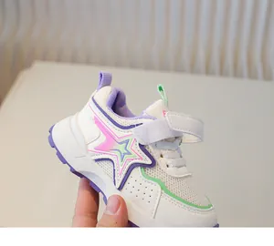 Detailed close-up of kids breathable mesh sneaker with purple thick rubber sole and star logo