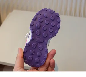 Detail of size 23 purple rubber sole with anti-slip texture for toddler sport shoes