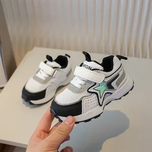 Kids breathable mesh sneakers with star pattern and velcro straps in black and white