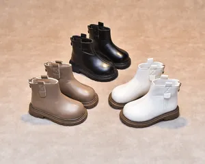 Rear view of children's leather boots showing functional metal zippers and rubber soles