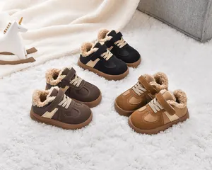 Close-up of children's winter boots with thick faux lamb wool lining and velcro straps