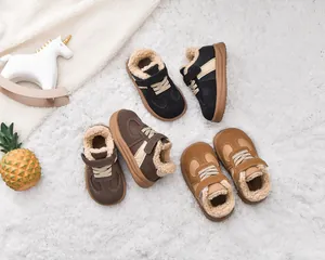 Detailed view of children's winter boots in black, brown and khaki with warm faux fur lining