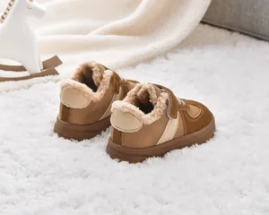Detail of warm lamb wool lining and suede fabric on kids winter snow boots with velcro strap
