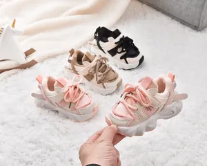 Detailed view of warm fleece lining and non-slip soles on kids winter sneakers