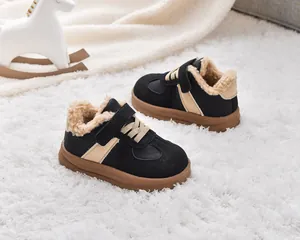 Detailed close-up of warm lamb wool lining and waterproof upper on kids winter snow boots