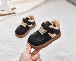 Detail of warm black kids winter sneakers with thick fleece lining and durable rubber sole