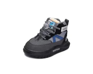 Detail view of winter kids' snow boots with thick faux fur lining and velcro strap