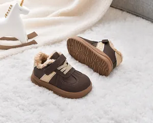 Close-up of children's winter shoes with warm faux shearling lining and wavy anti-slip sole