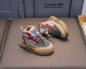 Close-up of children's fleece-lined snow boots with drawstring closure and non-slip sole