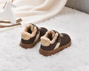 Detail of warm brown toddler winter boots with cozy fleece lining and nonslip rubber sole