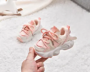 Detail of kids pink winter sneakers with warm fleece lining and chunky anti-slip sole