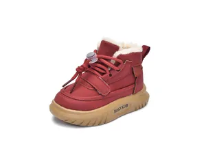 Detail view of red winter boot for kids with warm fleece lining and non-slip sole