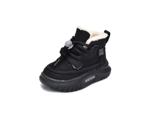 Detail of children's winter snow boots with thick white faux fur lining and drawstring